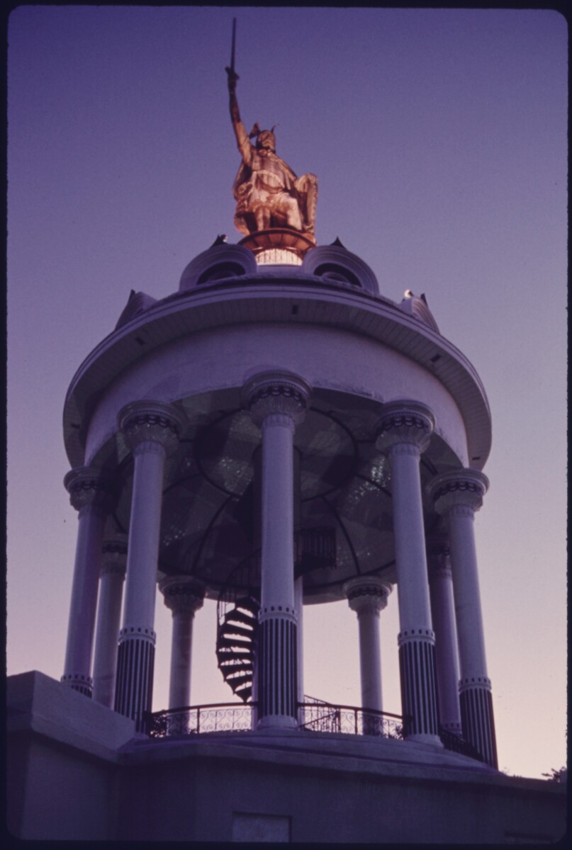 The Hermann Heights Monument in New Ulm, Minnesota, a copper statue of Hermann on a tall column.