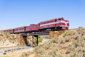 Restored former Commonwealth Railways diesel locomotive NSU52 crosses Saltia Bridge, near Quorn, South Australia, with a passenger train on 26 October 2019. It