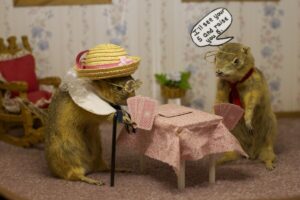 Two costumed gophers play cards at a table in a diorama at the World Famous Gopher Hole Museum in Torrington, Alberta.